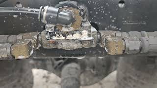 Famous Freightliner Cascadia bad air leak .  Bad quick release valve under frame back of fifth wheel. Profile
