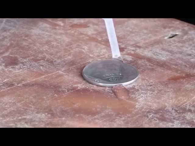 Surface tension  - water on a coin   (Suchana Science Mela 2015)