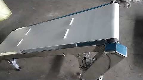 Pouch Take Up , Inclined Flat Cleated Belt Conveyor by Excel Conveyors www.Econveyors.in