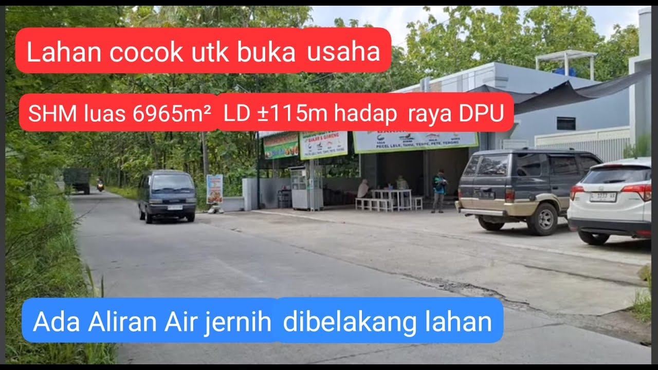 Lahan pinggir jalan raya, luas  6965m² Lebar muka depan ± 115m Ada Aliran sungai di belakang.