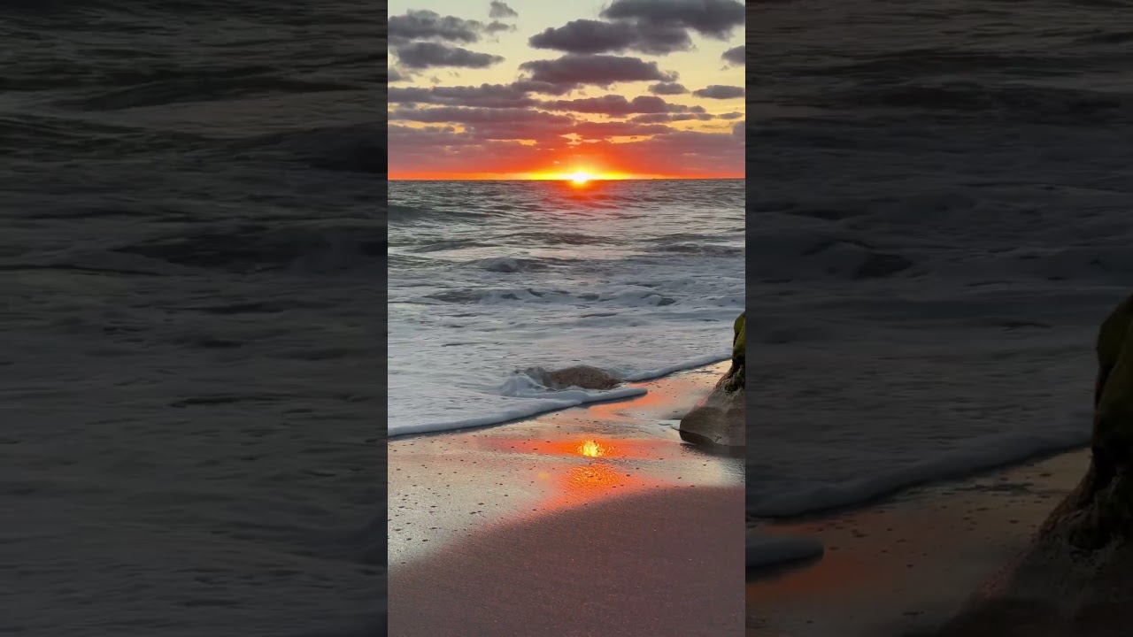 Orange sunrise with reflection 
