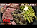 Tender Juicy Ribeye Steak with Sautéed Onions, Mushrooms and Asparagus