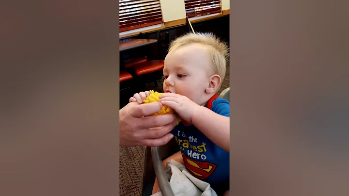 {Terri patrick} Baby  eating corn on the cob.