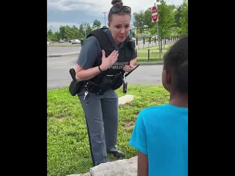 KID TERRIFIED ON SIGHTING A COP COMFORTED BY THE COP