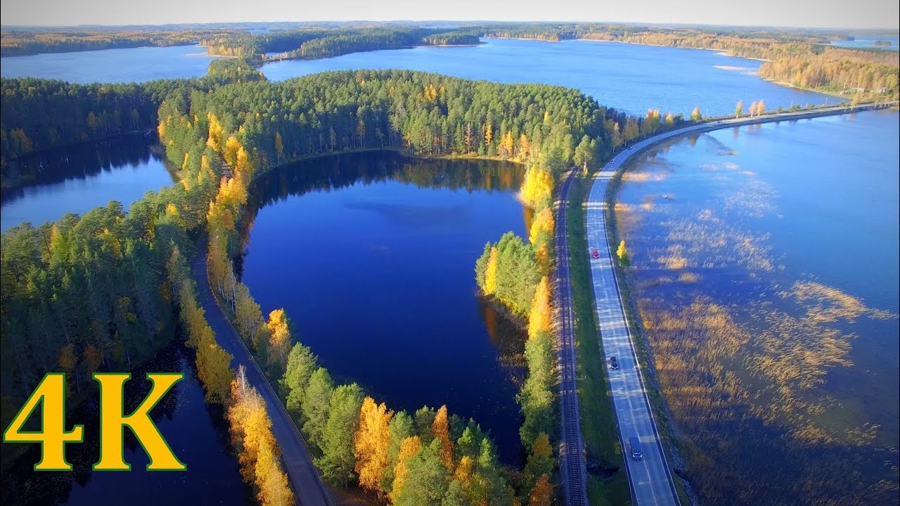 Flying above Finland Punkaharju Ridge  4K  autumn colors