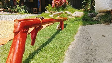How to make a slingshot from a hoe handle and trigger guided by green bamboo