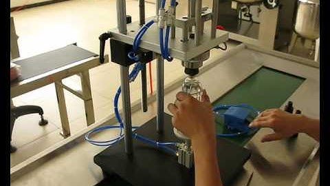 semi-automatic perfume bottle crimping machine perfume capping machine  .wmv