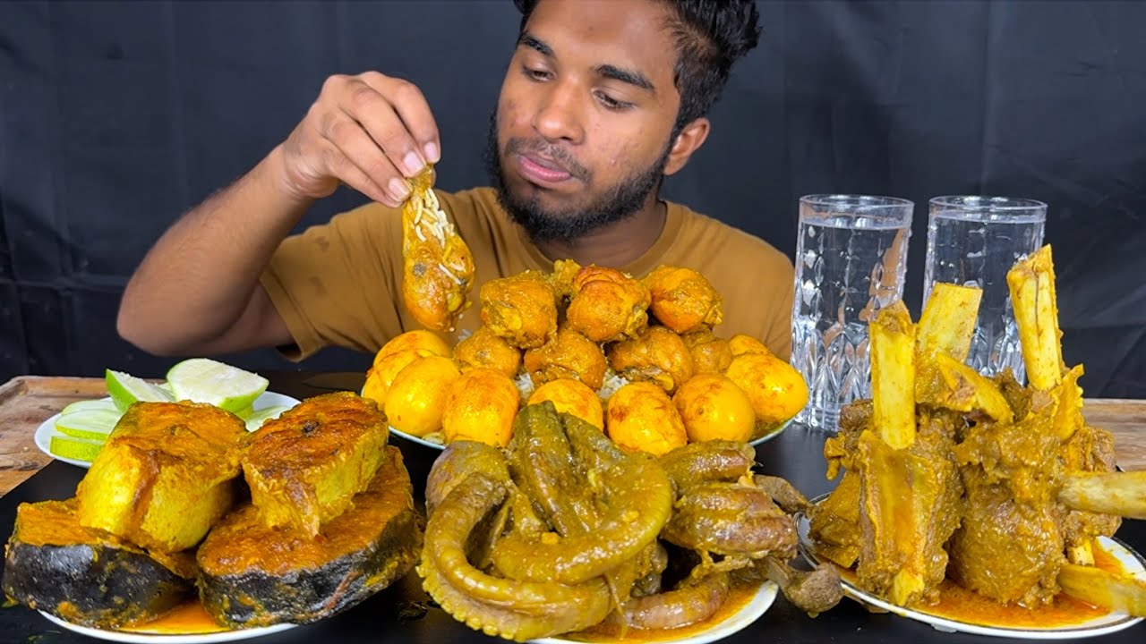 chicken leg piece curry, fish curry, buffalo chaap curry, mutton lungs curry and egg curry with rice