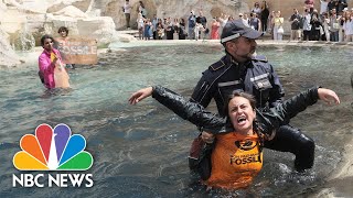 Watch: Climate activists pour black liquid into Rome’s Trevi Fountain