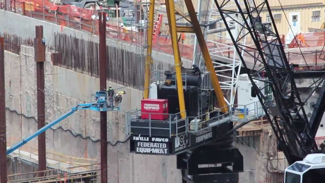 Favco M760D tower crane lifting concrete bucket YouTube