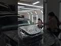 DYNOmatte film installation on a black Model Y hood