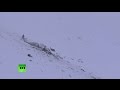 Helicopter crashes in Italian mountaines, rescue crew retrieves bodies i...