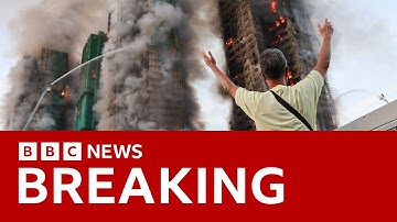 At least four killed as fire engulfs Hong Kong apartment blocks | BBC News