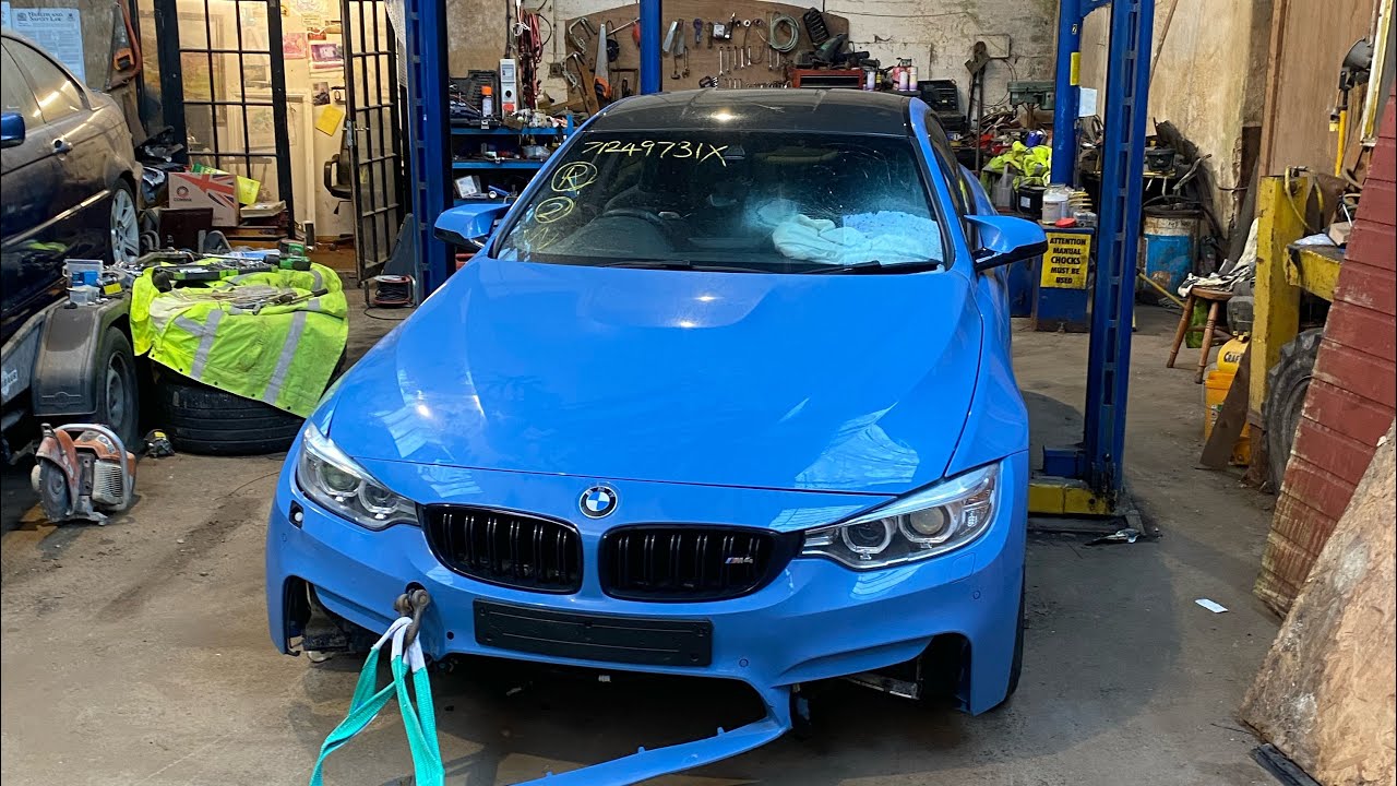 Rebuilding a salvage bmw m4 yas marina blue
