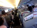 Air hostess dancing inside the air arabia flight