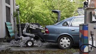 American EOD team trains with a robot to neutralize a vehicle-borne explosive at Ramstein Air Base