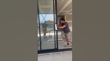 Stacking sliding door that disappears behind cavity pocket