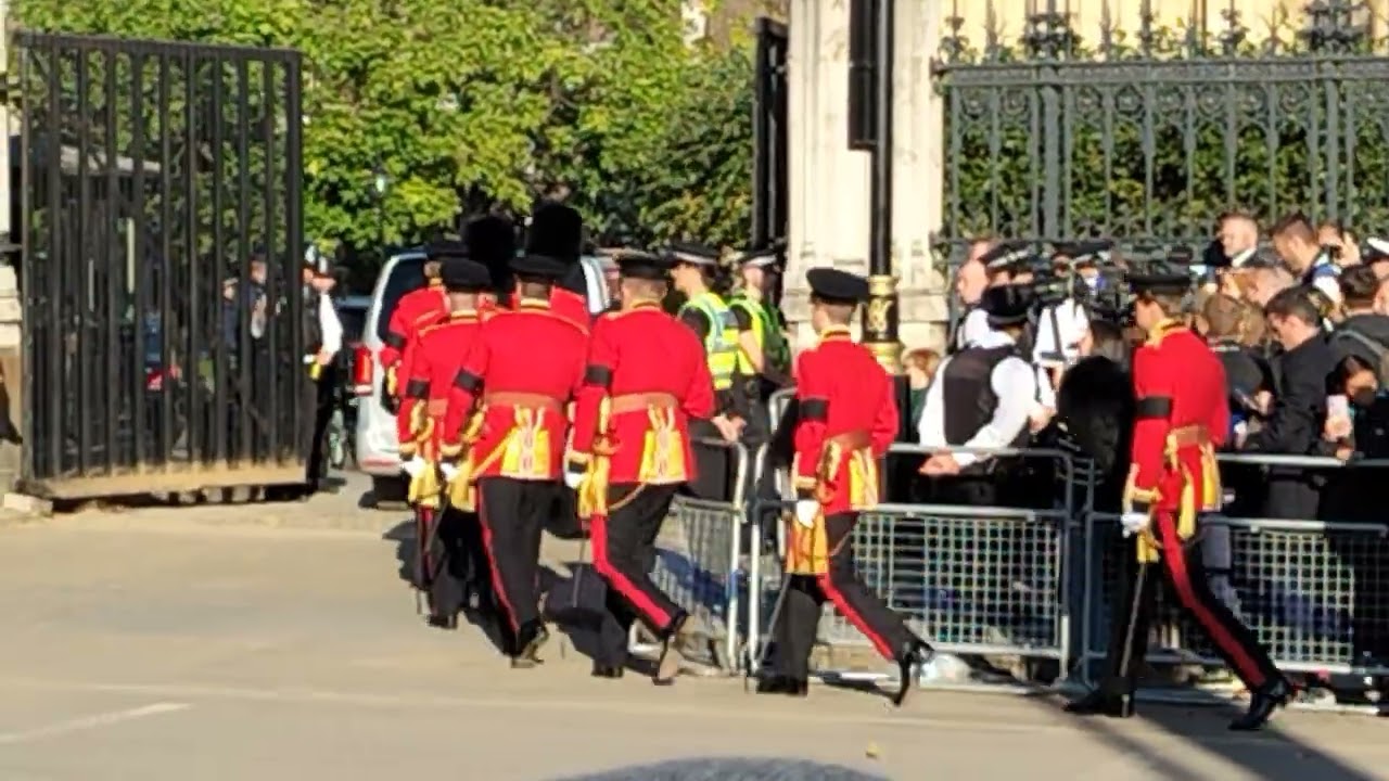 The Queen's guards now the king's guards entering Westminster Hall for