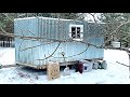 Tiny off grid cabin on wheels in the woods