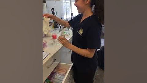 Loading a syringe with a drug from a multi-dose vial