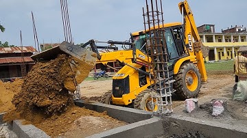 JCB Backhoe Filling Soil in New Bulding Foundation - JCB Backhoe Carrying Soil