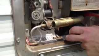 Replacing the water heater element in an RV. By Howto Bob