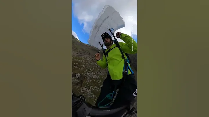 Tim Howell Rides Bike off Cliff in Daring Base Jum...