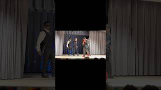 Artist with a huge support group performs on stage. He surprises the audience