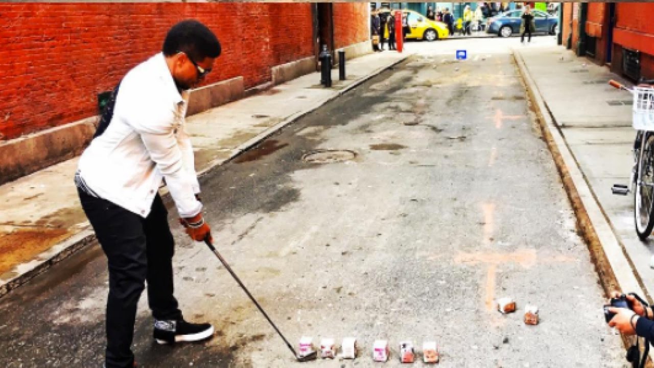 Usher Practicing His Golfing Skills Hitting Milk Cartons in SoHo New York