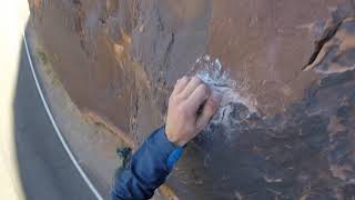 Climbing Fernando, 5.11b, in Wall Street, Moab