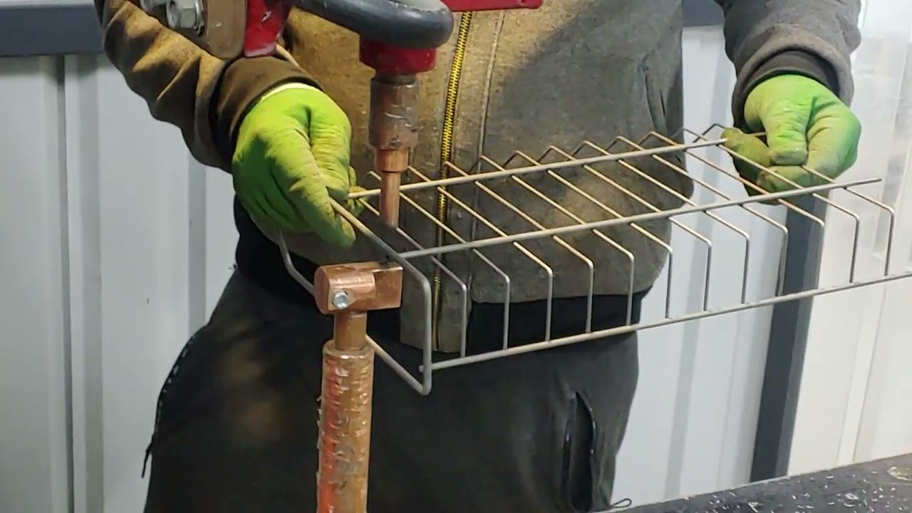 The birth of a wire basket for a supermarket shelf. The rhythm of things being born from metal.