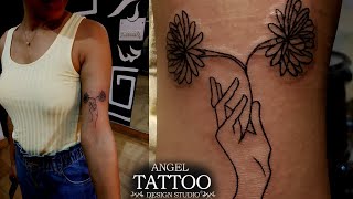 Tattoo for Born in the Month of November; Chrysanthemum Flower and a hand tattoo