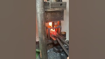 Punching holes  for axe making #blacksmithing #forge #blacksmith #axemaking #handmade