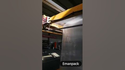 Fully automatic pallet wrapping machine and top dispenser