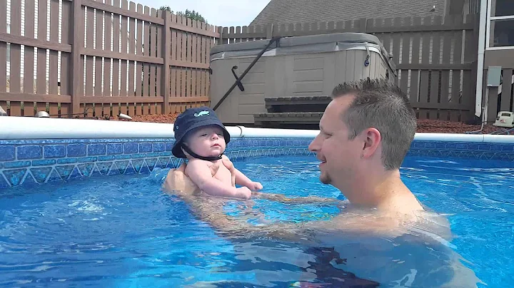 Emrys in the pool with daddy!