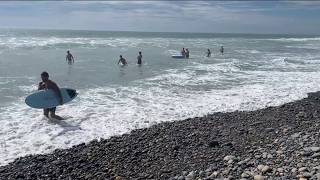 Carlsbad coastline impacted by erosion as high surf rolls in
