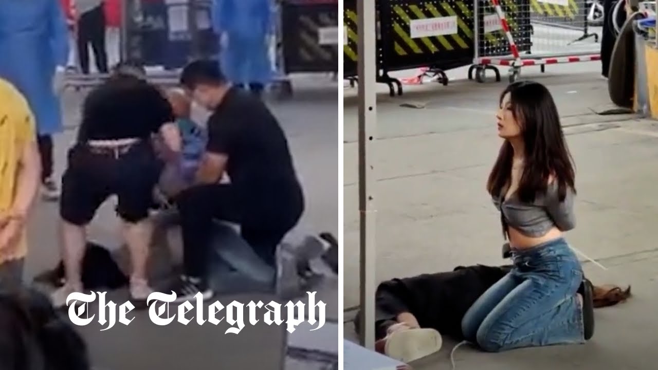 Women pinned to ground and hands tied by Covid security for not wearing mask in China