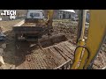 Towing A Truck With An Excavator - Loading Of Soil With An Excavator Onto A Truck