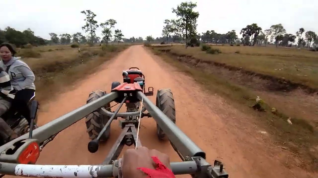Kubota ZT140 Tractor Driving Home on Dirt Road