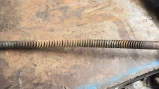 Straightening a bent threaded shaft