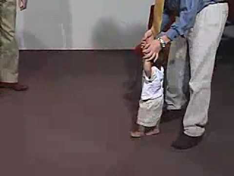 Neuro Exam 12 Month: Motor/Gait - Stand, Walks With Support