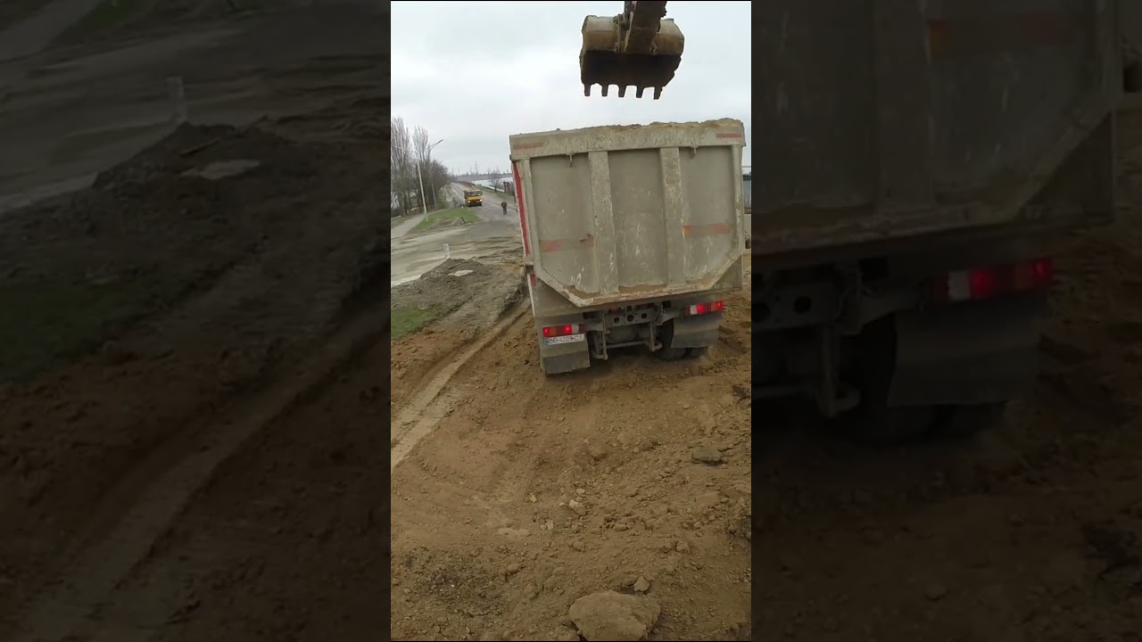 Deep Excavator Bucket Loading Dump Truck