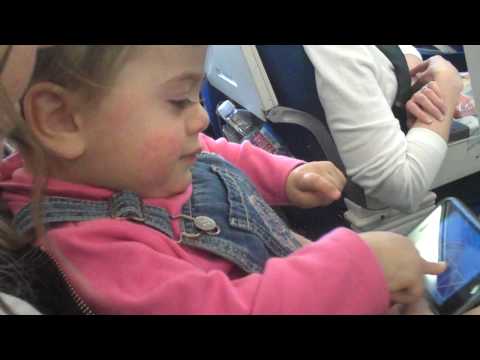 Megan plays Peek-a-boo Barn on the Airplane