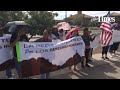 Protesters, who are against Obama's immigration proposal, chanting outside of the Department of Home