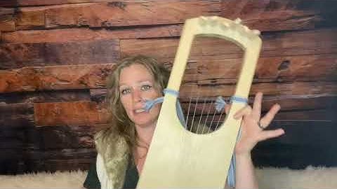 What is the strap on the back of the lyre for?