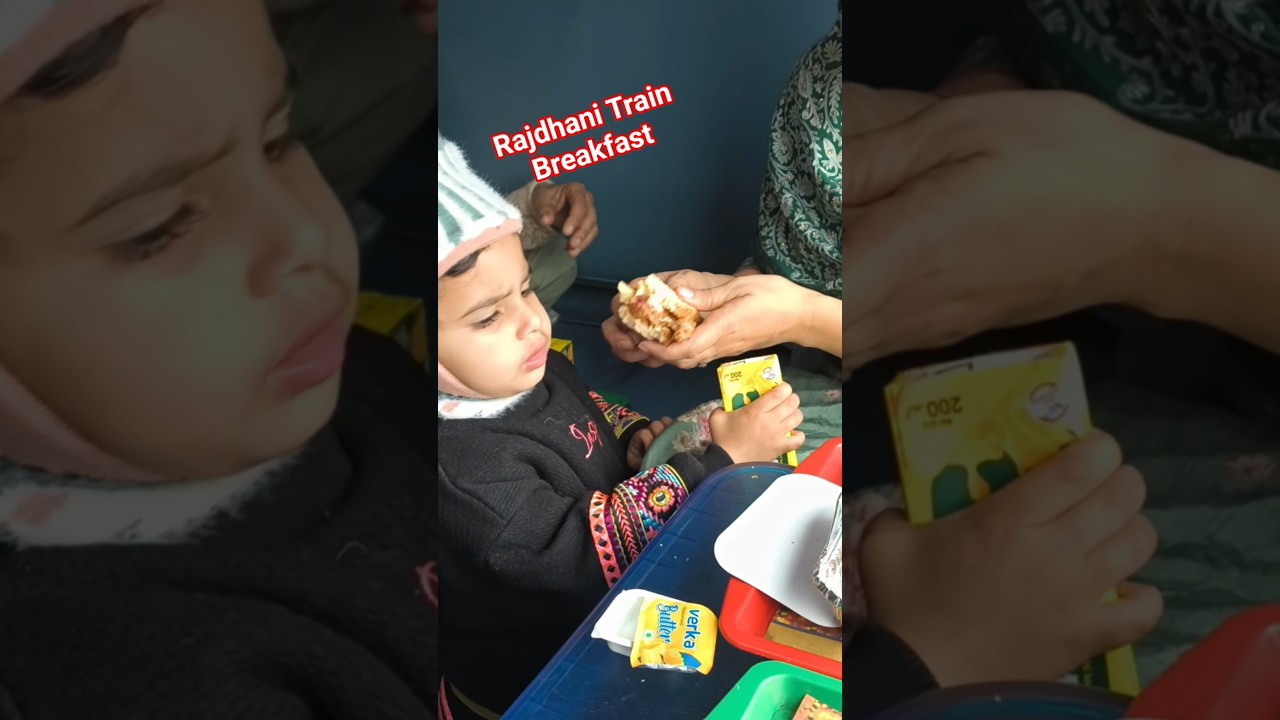 Amaira enjoying breakfast with her family on the Rajdhani Express A joyful train journey in India.