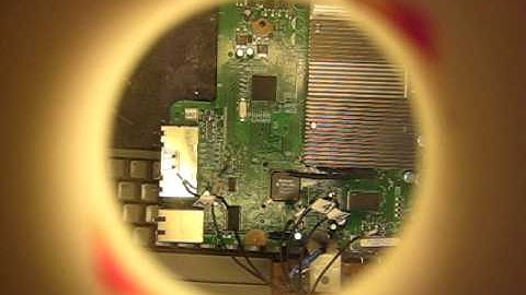 BoXXDr installing his custom Olimex nand read harness / adapter.