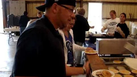 Kelly Krogh catching pancakes in his camisa... (th...