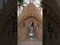 shark-house built entirely from sand, detailed sand architecture with realistic textures,
