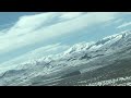 Desert Snow over Sagebrush and Mountains